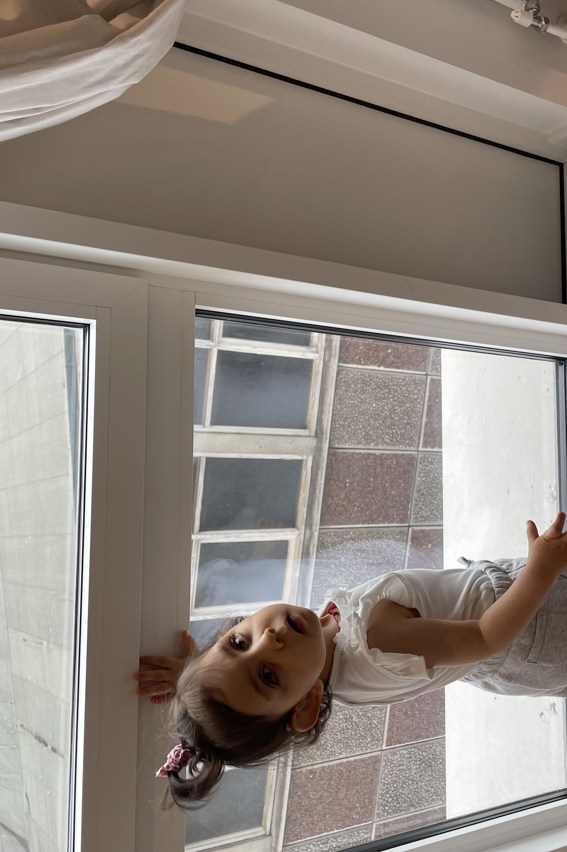 Emilia By Window